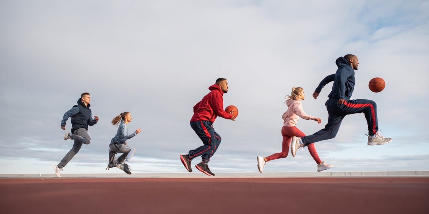 Runners of every age racing across an open track